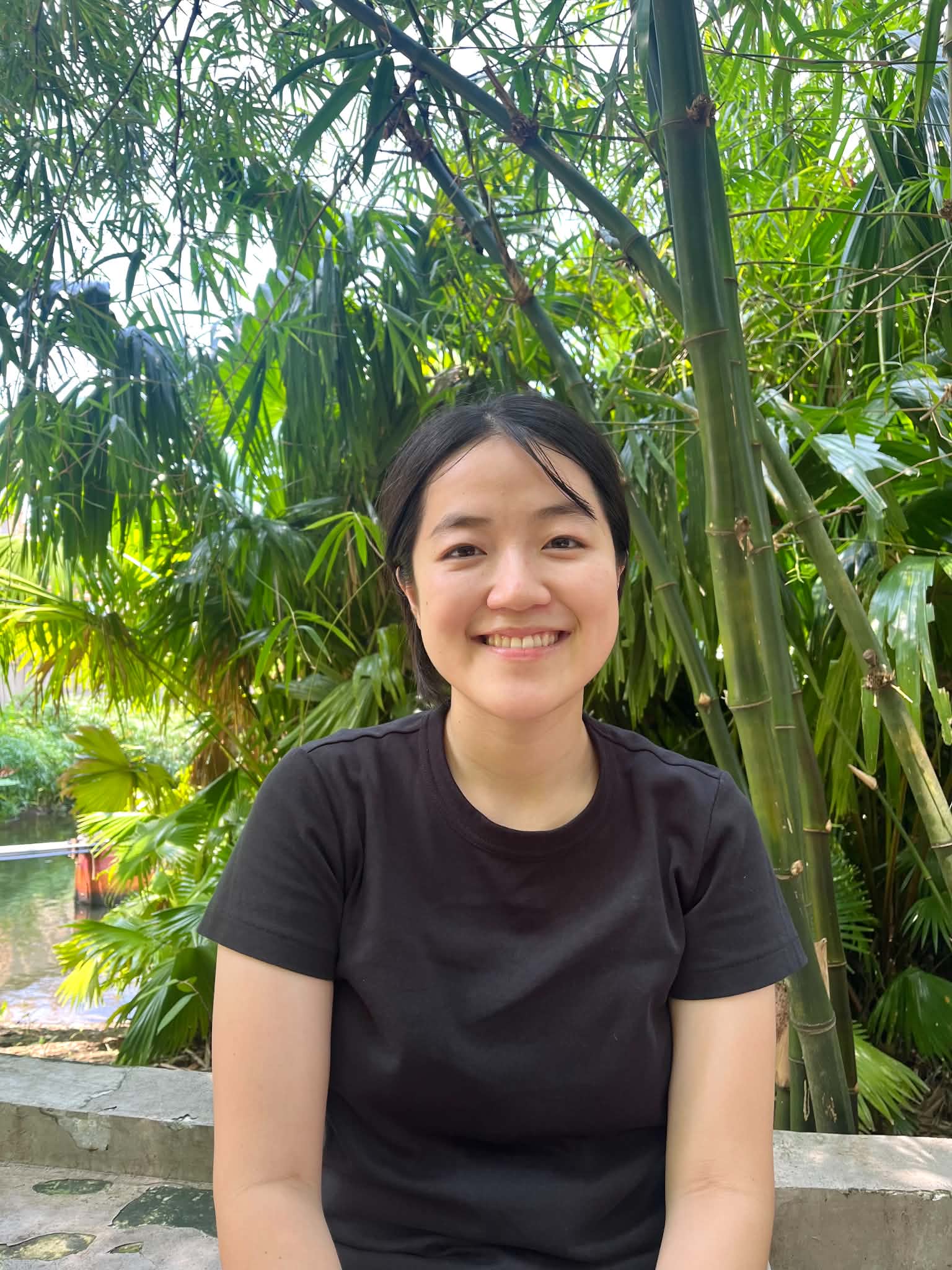 Yon, your Japanese teacher, smiling among bamboo